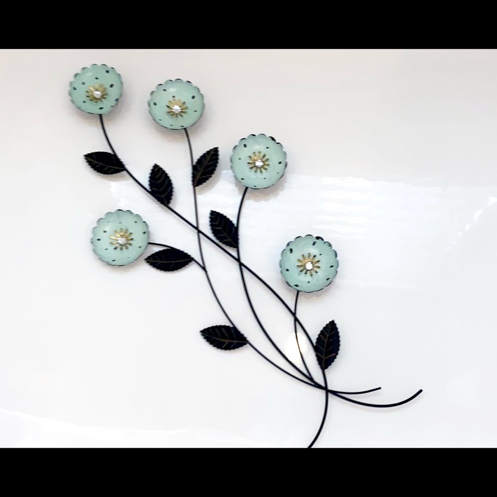 Metal floral wall hanging, 28 by 14 in